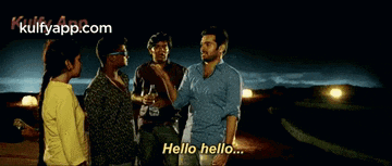 a group of people are standing next to each other and one of them is saying " hello hello "