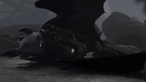 a toothless toy is laying on the ground