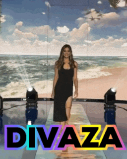 a woman in a black dress is walking down a runway with the word divaza in the corner
