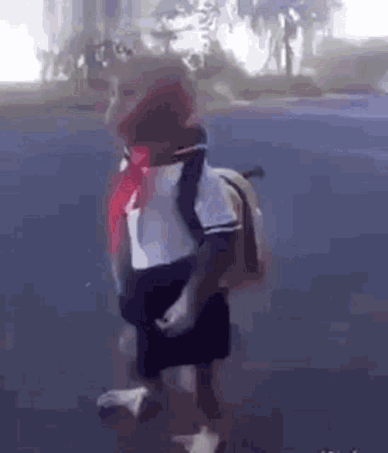 a monkey is wearing a school uniform and carrying a backpack .