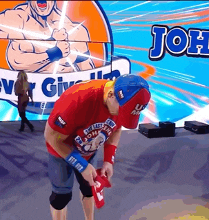 a man in a red shirt with the word john on the front