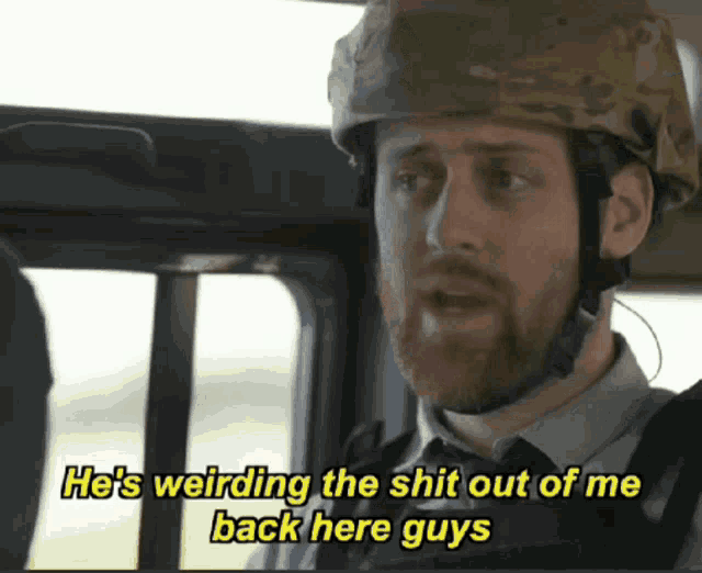 a man with a beard wearing a helmet says he 's weirding the shit out of me back here guys