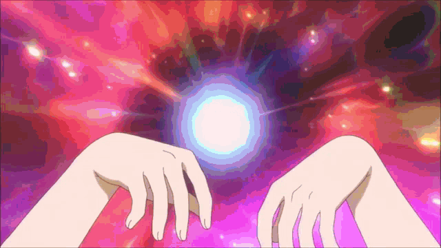 a person 's hands are reaching out towards a glowing object