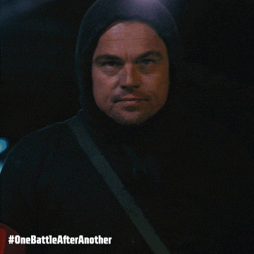 a man wearing a hooded jacket with the hashtag #onebattleafteranother on the bottom