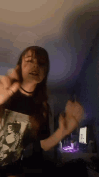a person in a black t-shirt with a picture of a woman on it