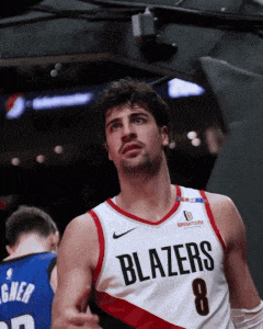 a basketball player wearing a blazers jersey with the number 8 on it