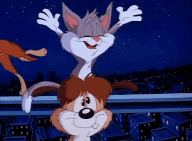 a cat and a dog are standing on a ledge with their arms outstretched