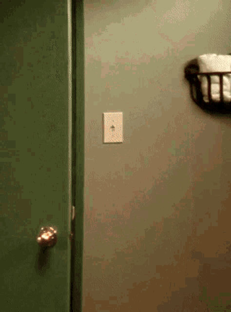a light switch on a wall next to a door