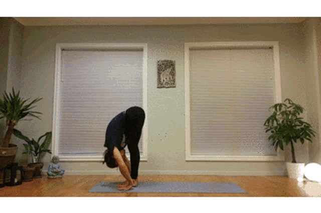 a person doing a yoga pose in a room