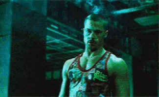 a man is wearing a tank top that says ' black belts ' on it