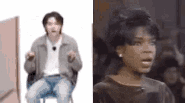 a man is sitting in a chair and a woman is standing next to him .