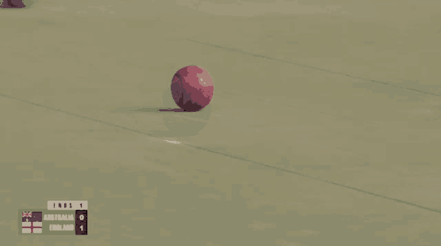 a bowling ball on a field with a scoreboard that says ends 9 australia 0 england 1