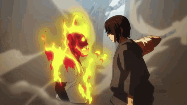 a man is standing in front of a skeleton that is on fire