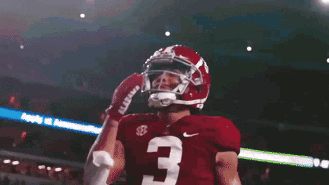 a football player wearing a helmet and jersey with the number 3 on it