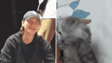 a man wearing a hat is smiling next to a kitten