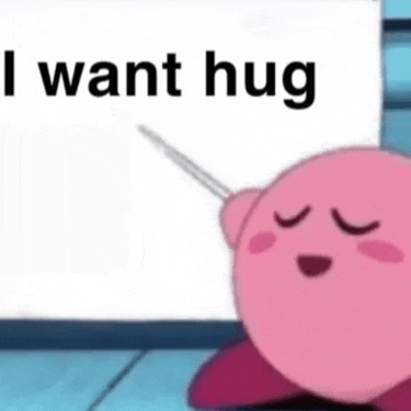 kirby is holding a needle in front of a sign that says `` i want hug '' .