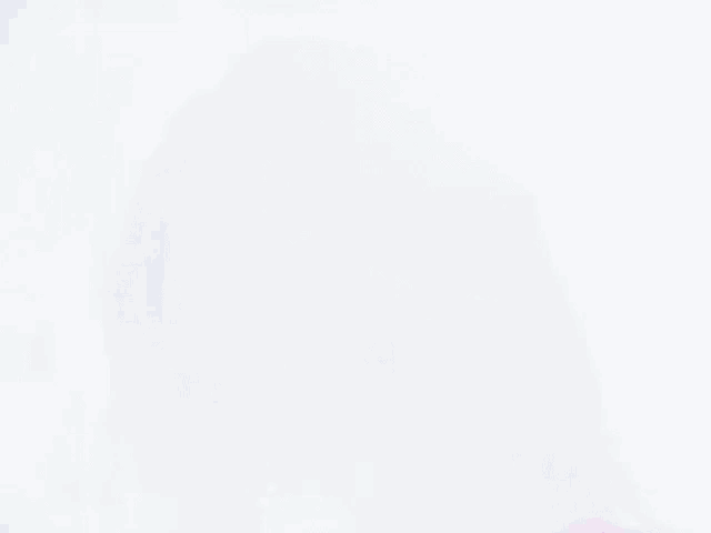 a close up of a woman 's face with the sun shining through it .