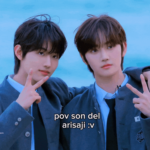 two boys pose for a picture with a caption that says pov son del arisaji