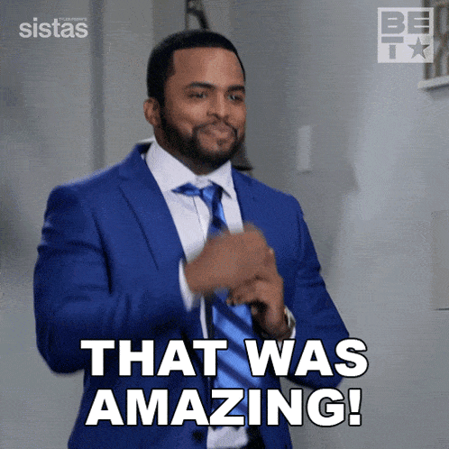 a man in a blue suit and tie says " that was amazing "