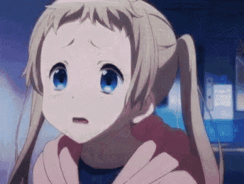 a girl with blonde hair and blue eyes is looking at the camera with a surprised expression on her face .