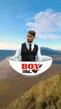 a man is in a bowl that says boy