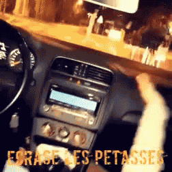 a picture of a person driving a car with the words " e9rage les petasses " on the bottom