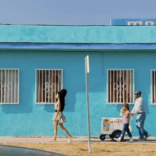 a blue building with a sign that says lacoste