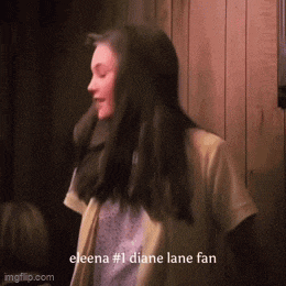elena # 1 diane lane fan is standing in front of a wood wall