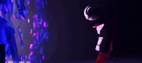 a cartoon character is standing in front of a purple and blue wall .