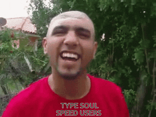 a man wearing a red shirt with the words type soul speed users on it