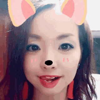 a close up of a woman 's face with a fake nose and ears .