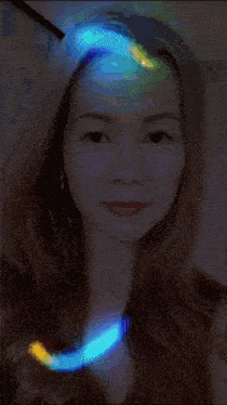 a pixelated image of a woman 's face with a blurred background
