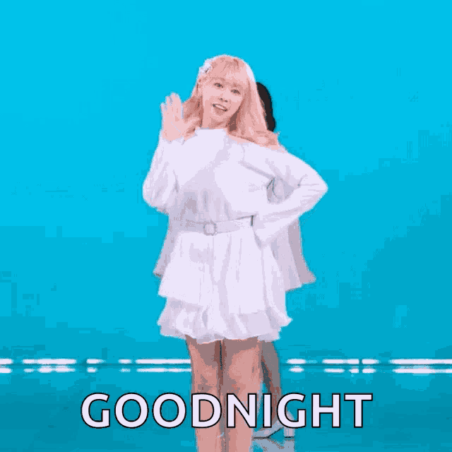 a woman in a white dress says goodnight