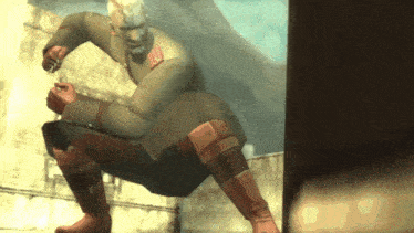 a man in a military uniform is squatting down and holding something