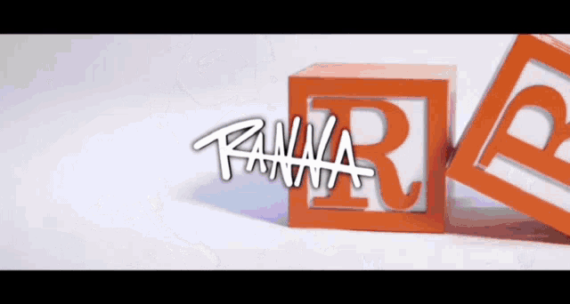 two orange blocks with the letter r on them and the word wanna on the bottom