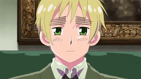 a boy with blonde hair and green eyes is wearing a green shirt and tie