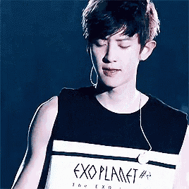 a young man wearing a black shirt that says exoplanet # 4 on it
