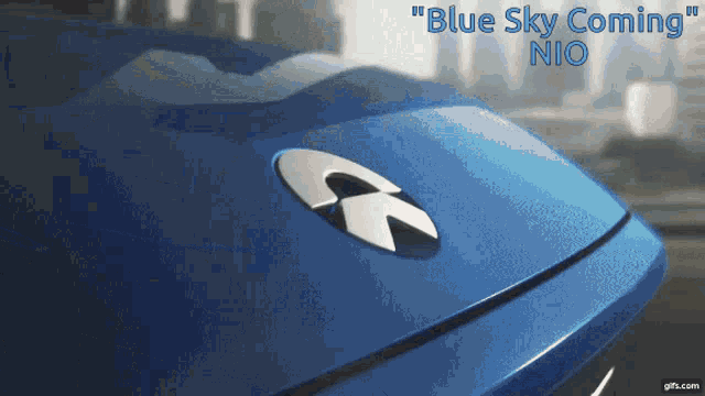 a blue car with the words " blue sky coming " written on it