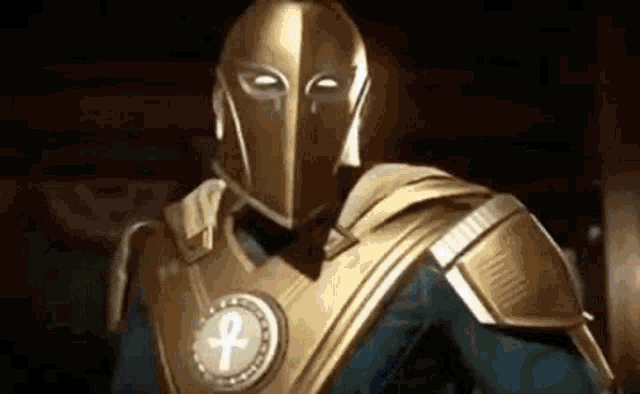 the doctor fate is wearing a gold helmet and armor .