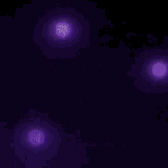 a purple light swirls in the dark on a black background .