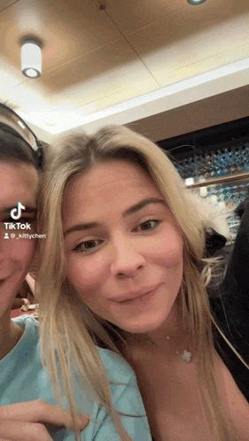 a woman 's face is shown in a tiktok video by @kittychen