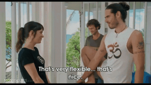 a man in a white tank top with the number 35 on it is talking to a woman