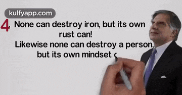 a man in a suit and tie is holding a pen in front of a sign that says " none can destroy iron