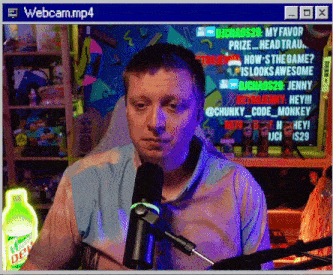a man sitting in front of a microphone with a webcam.mp4 window open