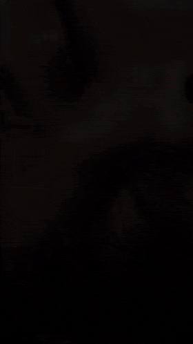 a close up of a woman 's face with a blurry background .