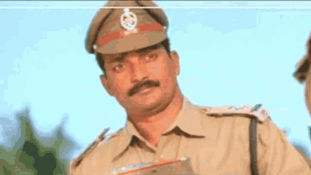 a man with a mustache is wearing a hat and holding a briefcase .