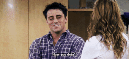 a man in a plaid shirt is talking to a woman and says how you doin '
