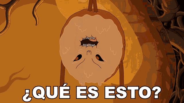 a cartoon character is hanging upside down with the words qué es esto written below it