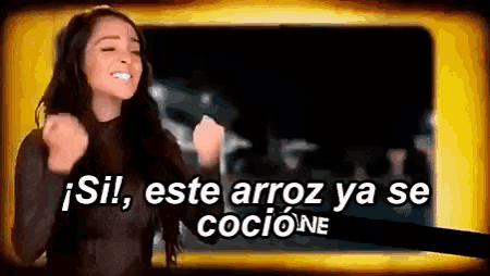 a woman with her fist in the air and the words " si este arroz ya se cocione "