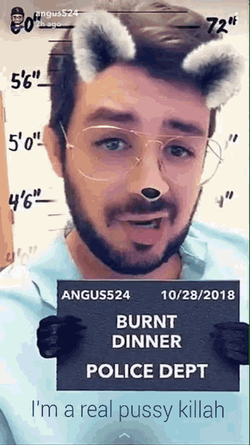 a man with a beard and glasses holding a burnt dinner police dept sign